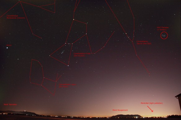 Constellations Orion and Taurus above the landscape.